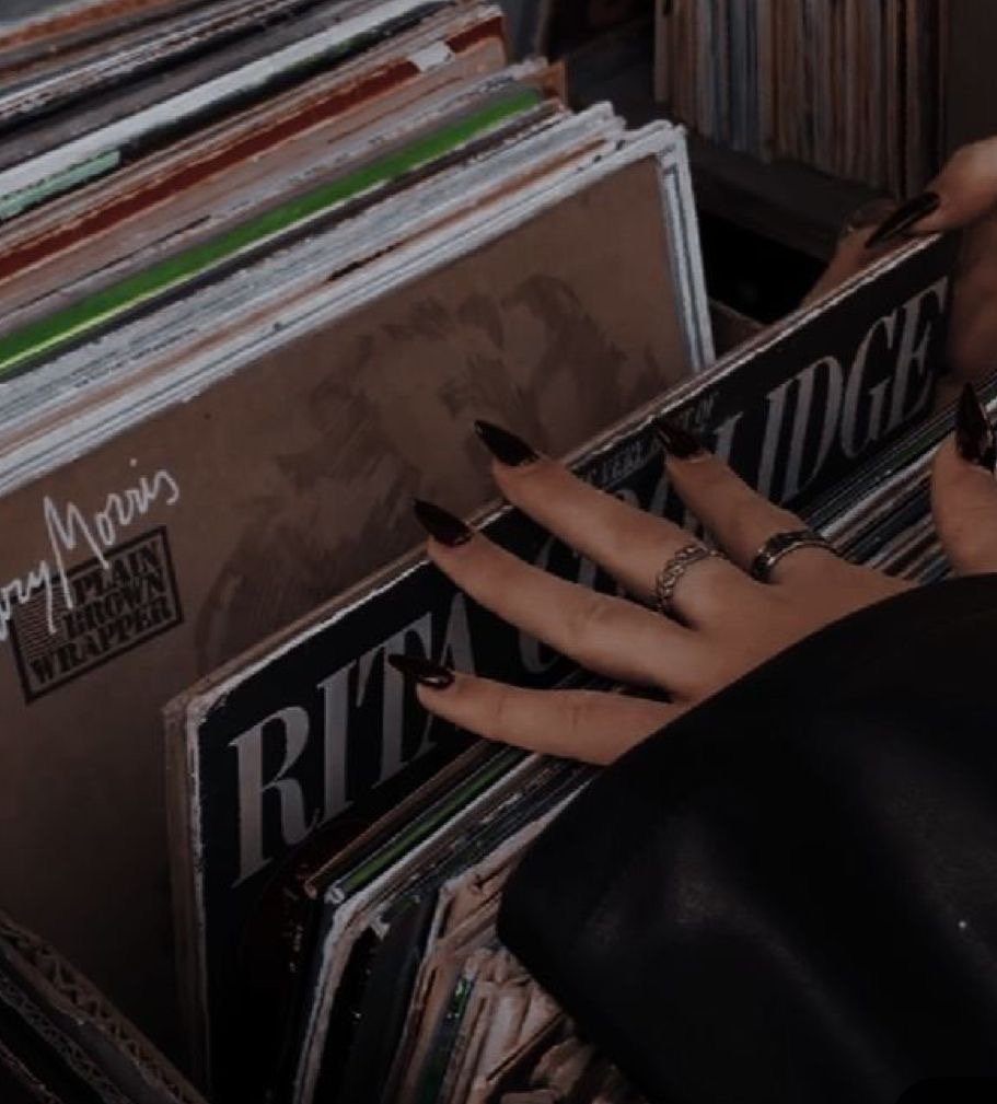 Flipping through records in a crate