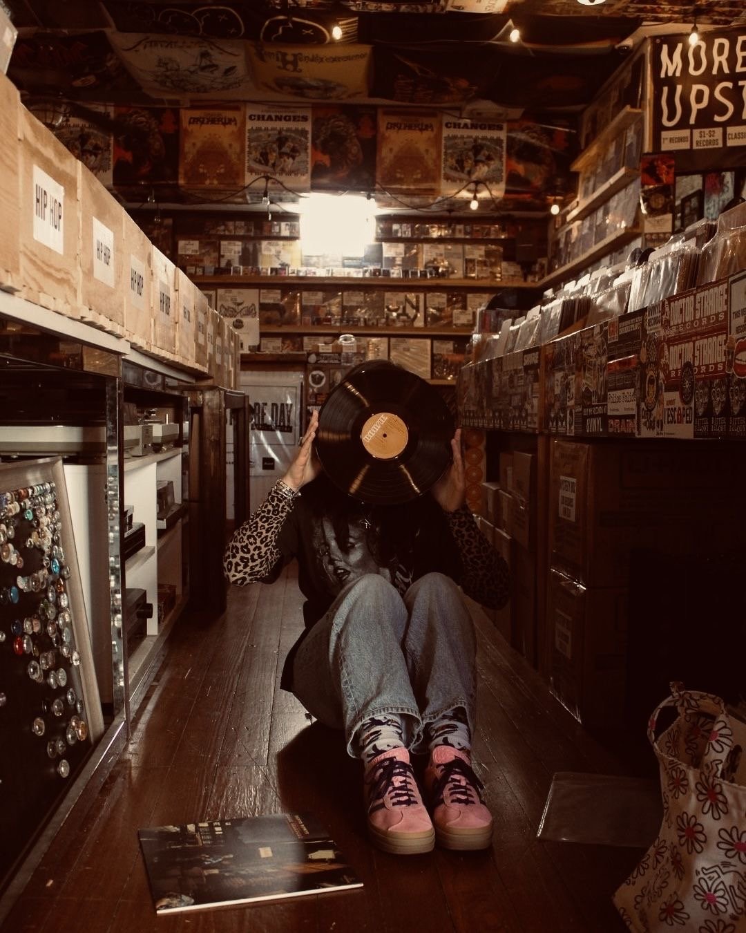 Holding a vinyl record in a record store